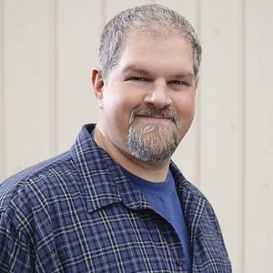 Fotoğraf Men in Trees